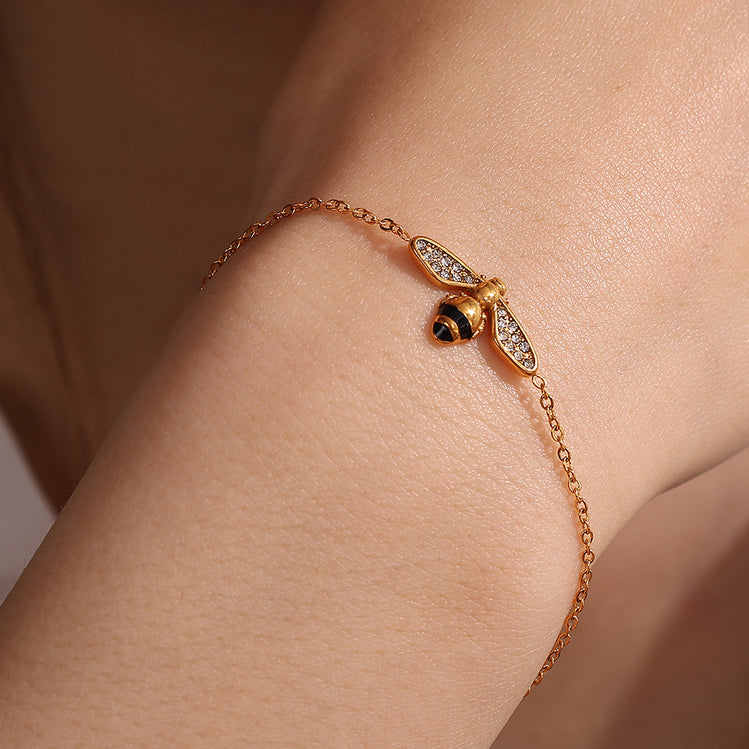 The Jazzy Owl Bee Mine Bracelet with its delicate gold-tone chain and mini bee charm